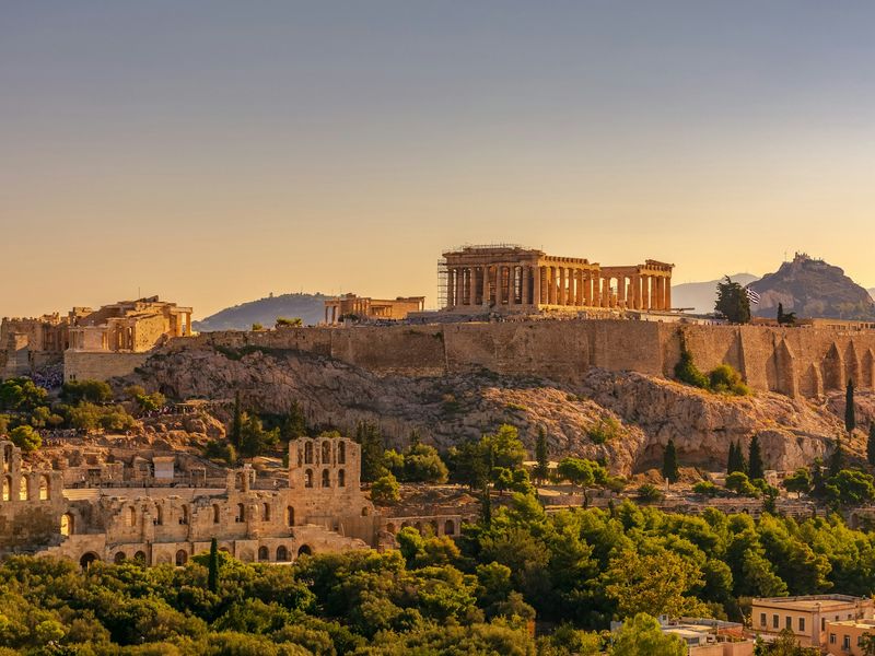 View of Acropolis of Athens with Parthenon and Erechtheion from Filopappou hill. Herodium, Lycabettus and Acropolis of Athens view from Filopappou hill a summer sunny day